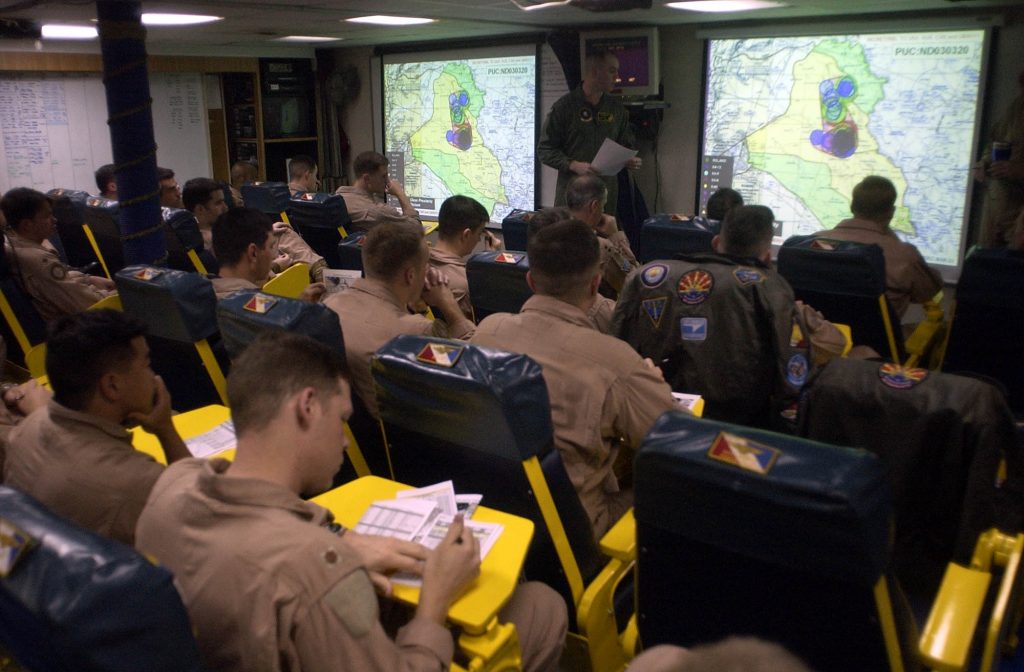 030321-N-4142G-020 Arabian Gulf (Mar. 21, 2003) -- Pilots assigned to Carrier Air Wing Two (CVW-2) listen to a pre-flight brief in one of the squadron ready rooms. Constellation and her embarked CVW-2 are conducting combat missions in support of Operation Iraqi Freedom. U.S. Navy photo by Photographer's Mate 2nd Class Felix Garza Jr. (RELEASED)